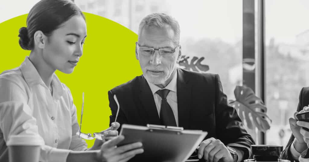 Business colleagues going over a GDPR compliance checklist.