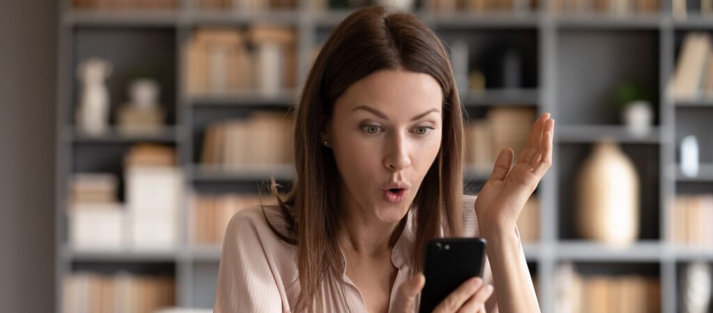 Woman interacting with loyalty program automation on a mobile device.