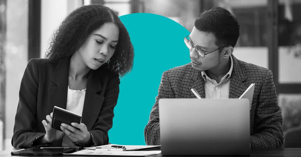 Colleagues working on marketing plan components.