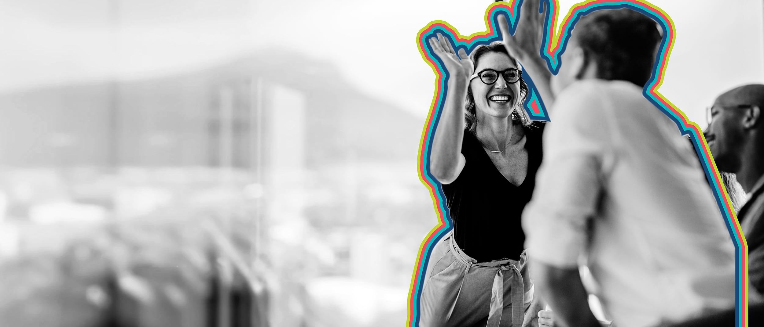 Two colleagues celebrate success with sales enablement best practices.