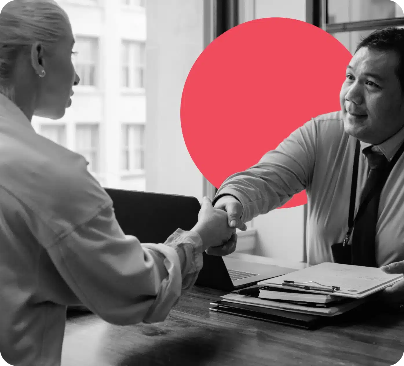 Financial advisor shaking hands with a client.