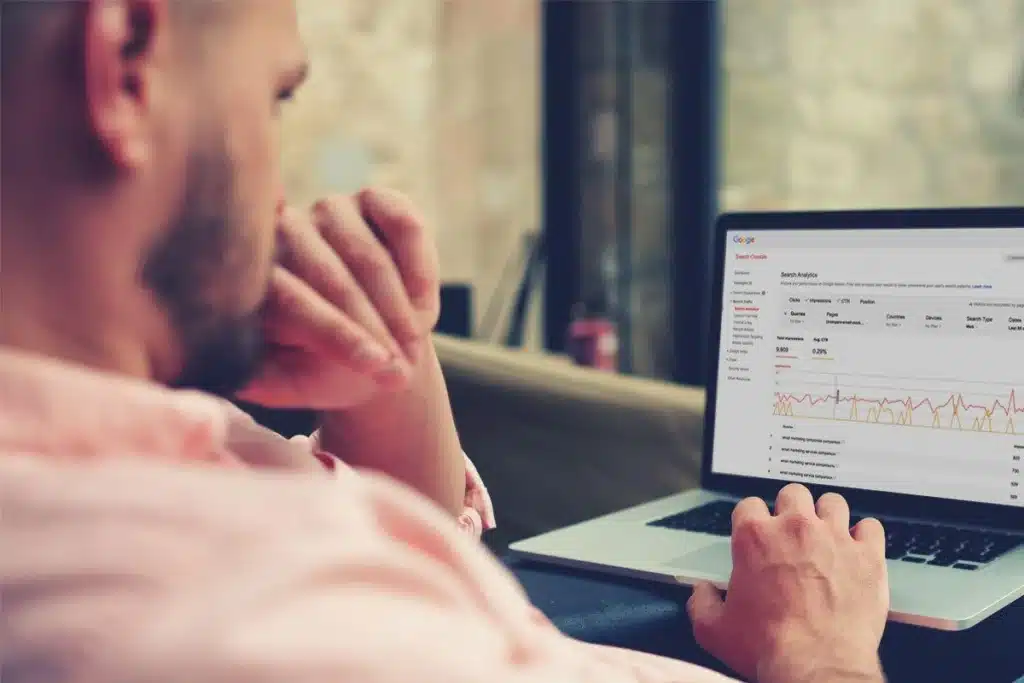 Man learning SEO basics on his laptop.